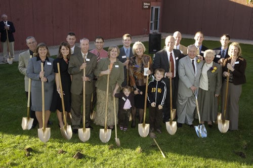 Dale Howard Chevrolet family holding shovel in backyard